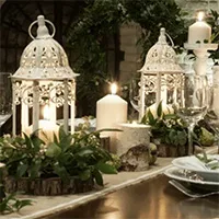 rustic-candlelit-event-table-centrepiece.webp